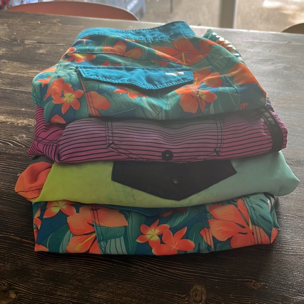 Boys swim trunks size 8 and 10- 4 pair. Hurley/Cat and Jack